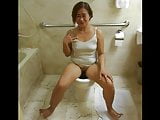 Fat mature asian Diana exhibs her boobs and pees