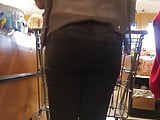 Beautiful woman in grey jeans & heels