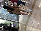 Slim slut in figure hugging dress with tight ass